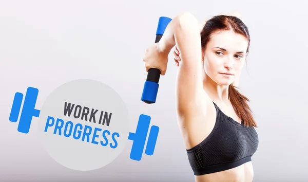 Work in progress, woman with dumbbell — Stock Photo, Image