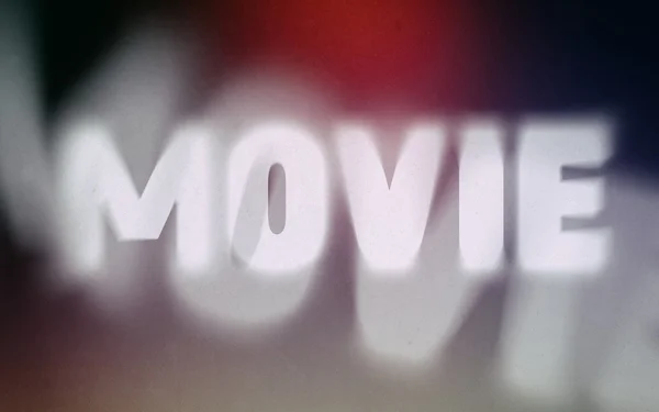 Movie word on vintage blurred background — Stock Photo, Image