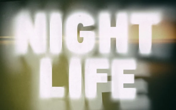 Night life word on vintage blurred background — Stock Photo, Image