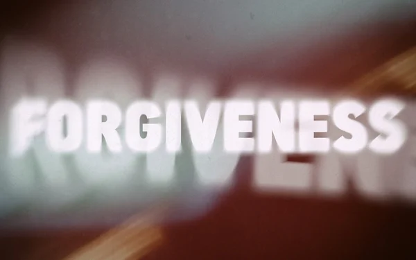 Forgiveness word on vintage blurred background — Stock Photo, Image