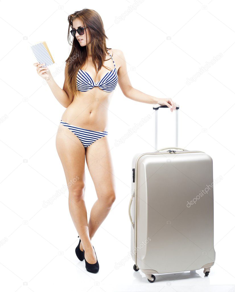 Tourist woman in bikini with suitcase isolated