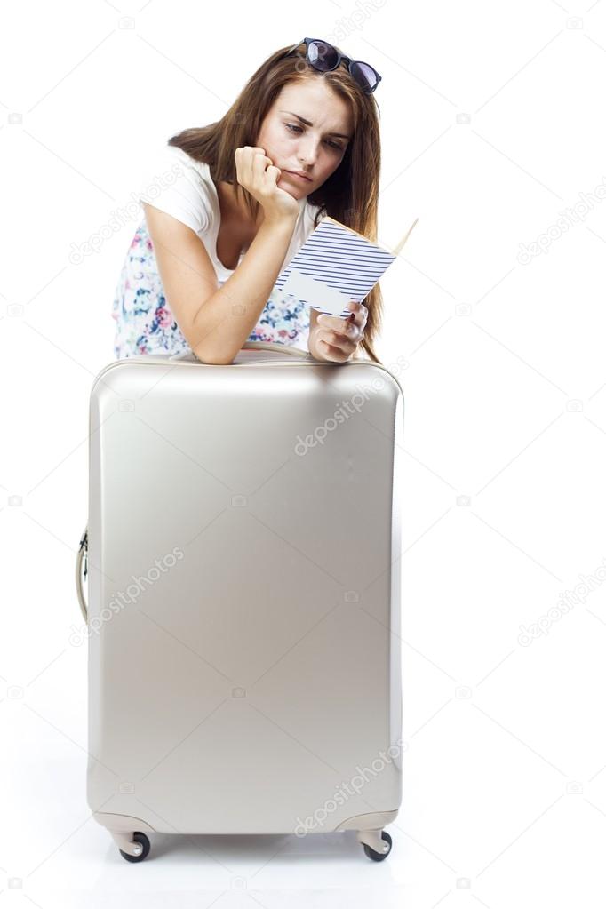 Woman reading map or tourist guidebook isolated
