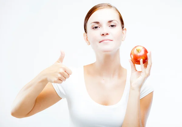 Mujer sosteniendo y comiendo manzana roja, Dientes sanos —  Fotos de Stock