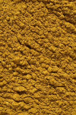 Kuru sarı köri, öğütülmüş zerdeçal, kimyon, kişniş, zencefil ve kurutulmuş biber içeriyordu. Doku veya arkaplan makro çekimi.