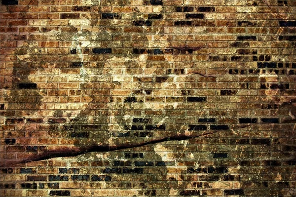 Gebarsten bakstenen muur — Stockfoto