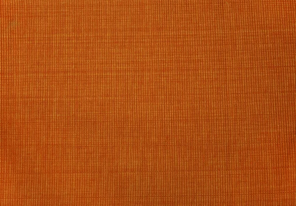 Orange textil bakgrund — Stockfoto