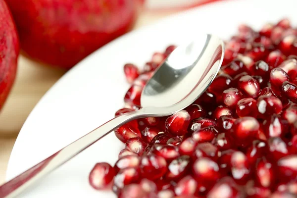 Pomegranate and Spoon — Stock Photo, Image