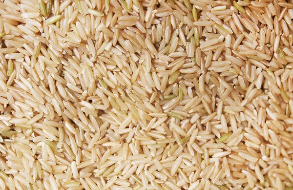 Råa ekologiska ris bakgrund — Stockfoto