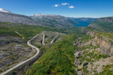 Scenic Nordland County, Norway. Saltfjellet Svartisen National Park Summer Aerial Scenery. Road to the Fjord. clipart