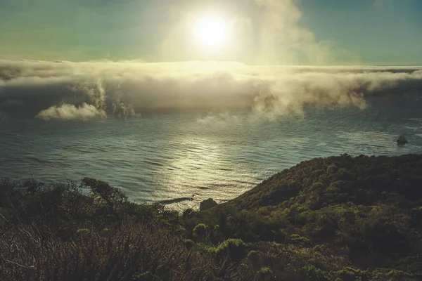 Coastal Southern California Sunset Scenery with Fog Rolling In. Scenic California Highway 1 Landscape. Pacific Ocean.