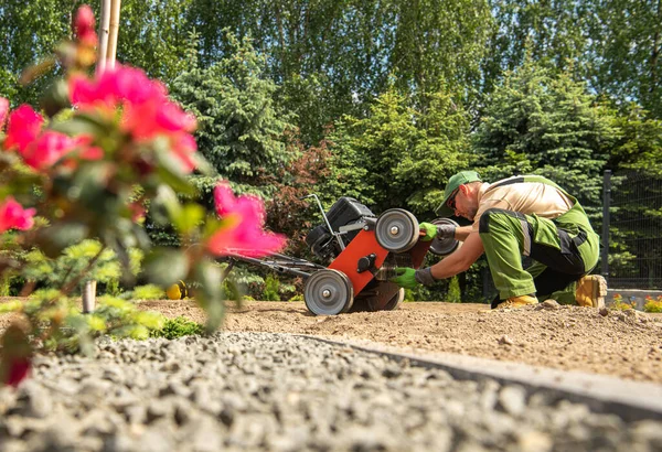 Caucasian Landscaping Worker Checking His Gasoline Aerator Machine Looking Potential Royalty Free Stock Photos