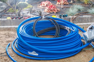 Residential Garden Drip Irrigation Pipeline at the System Elements Like Valves Prepared For the Installation. Landscaping Industry Theme.
