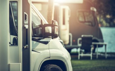 Motorhomes in a RV Park During High Vacation Season. Class C Recreational Vehicles.