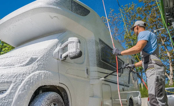 Caucasian Men His 40S Pressure Washing Modern Class Camper Van — стоковое фото