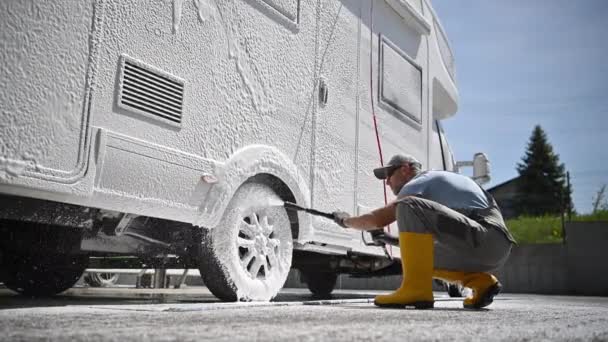 Powerful Pressure Washing Camper Van Rental Company Worker Cleaning Motorhome — стоковое видео