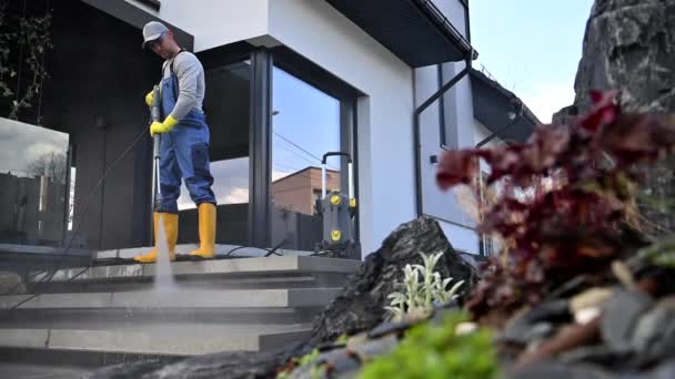 Caucasian Men Pressure Washing House Surrounding Concrete Elements Cleaning Paths — Wideo stockowe