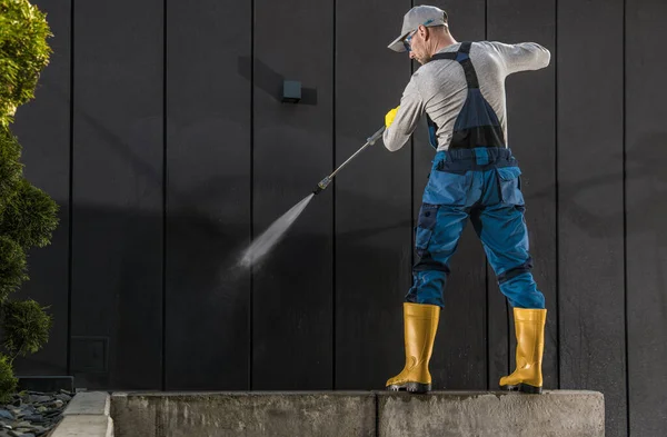 Caucasian Worker His 40S Cleaning Modern Building Dark Wall Using — Stock Photo, Image