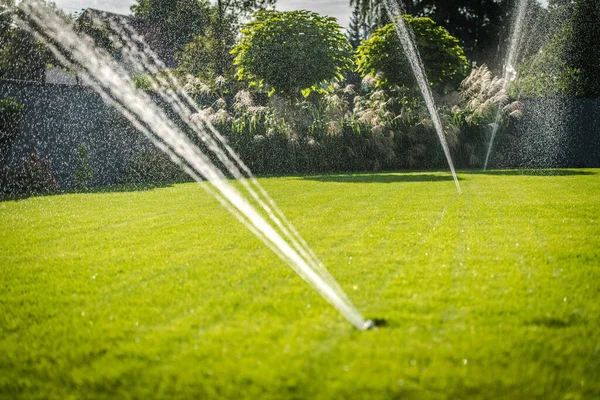 Sprinkling Lawn Automatic Garden Watering System Taking Care Grass Hot — Stock Photo, Image