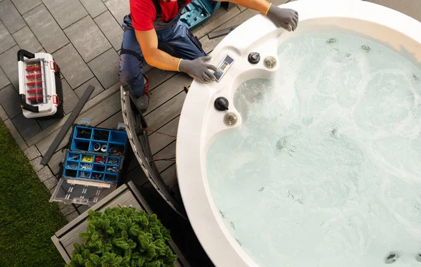 Professional Caucasian Hot Tub Technician Servicing Circular Spa Residential Backyard — ストック写真