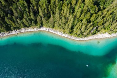 Scenic Aerial Shoreline Vista of the Eibsee Lake Near Garmisch-Partenkirchen, Bavaria Germany. Forest Line and the Lake.