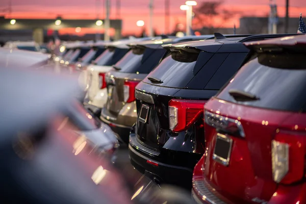 Line of Brand New Sport Utility Vehicles for Sale Parked at the Dealer Park. Automotive and Transportation Industry Theme.