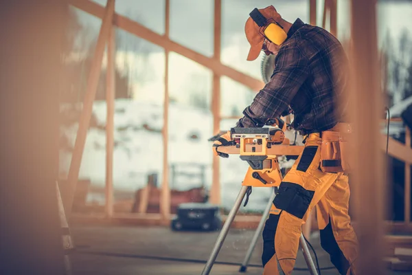Professional Construction Worker Wearing Noise Reduction Headphones Planing Wood Plank — Fotografia de Stock