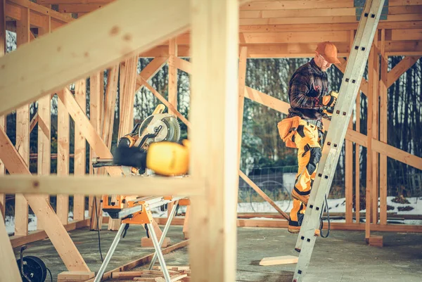 Caucasian Worker Going Stepladder Check Roof Section Wooden Skeleton Residential — Stok fotoğraf