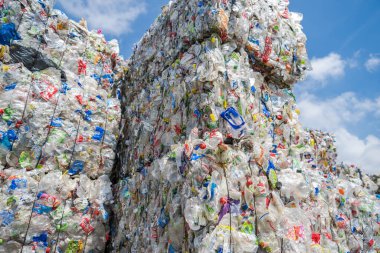 Collected Compacted and Ready For Recycling Process Plastic PET Bottles. Piles of Plastic Waste For Reprocessing.