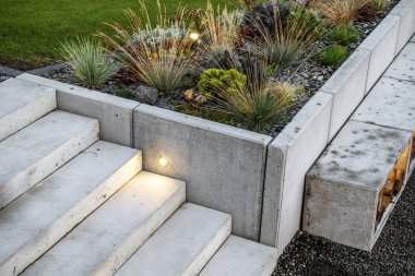 Modern Rockery Garden and Small Concrete Architecture. Illuminated Outdoor Backyard Stairs.