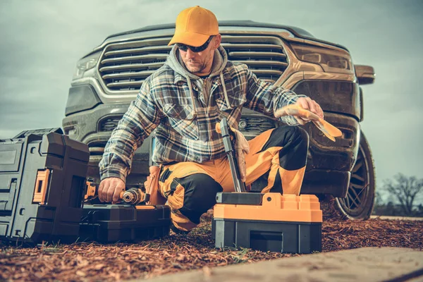 Caucasian Male Contractor Kneeling Toolboxes Just Taken Out His Pickup — Foto Stock