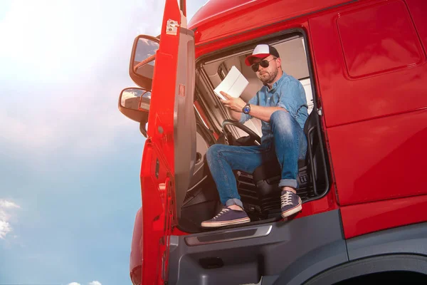 Caucasian Lorry Driver Sitting Cabin His Red Semi Truck Carefully — Stock Fotó