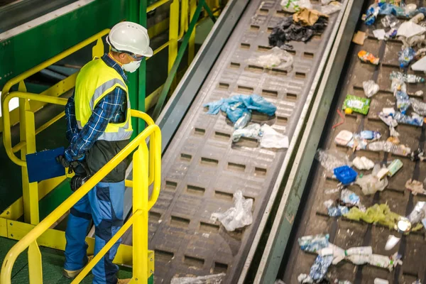 Waste Sorting Facility Management Control. Trash Conveyors Operator Performing Daily Check.