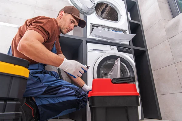 Caucasian Worker His Fixing Unclogging Washing Machine His Clients Laundry — стокове фото
