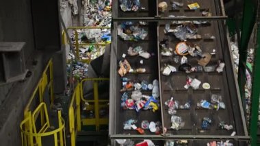 Waste Sorting Facility Conveyor Moving Trash Along. Trash Recycling Theme