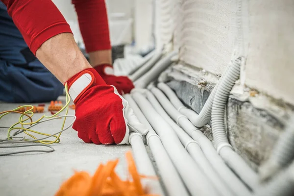 Closeup Electricians Hands Red Protective Gloves Checking Plastic Pipelines Electric — Foto Stock