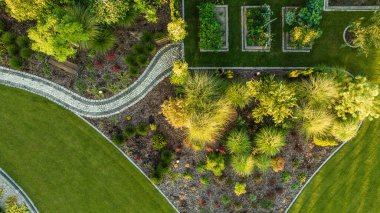 Aerial View of Modern Beautiful Backyard Garden with Three Vegetables Wooden Pots. Summer Time in a Garden.