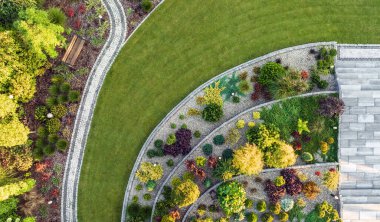 Aerial View of a Large Moden Residential Backyard Garden with Granite Brick Paths, Bench and Large Stairs. 