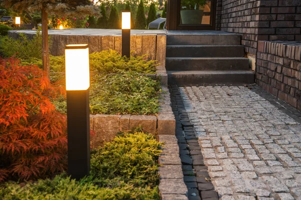 Backyard LED Light Posts Along the Garden Path. Illuminating Landscapes with Modern Outdoor Lighting Systems.