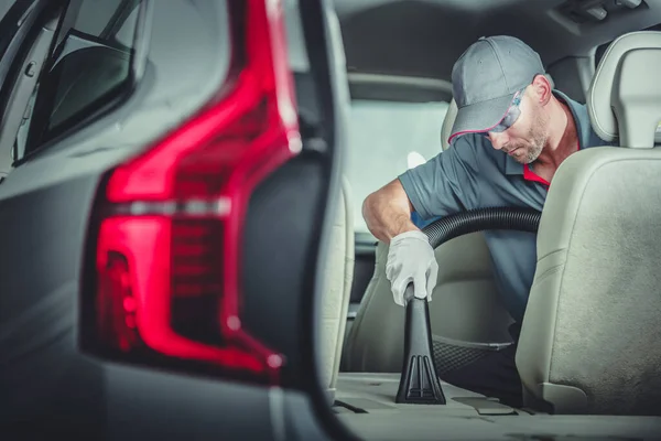 Caucasian Auto Detailer Precisely Vacuuming Folded Car Back Seat Premium — 스톡 사진