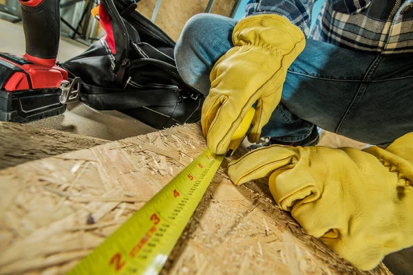 Closeup Photo Construction Worker Yellow Protective Gloves Measuring Oriented Strand — 스톡 사진