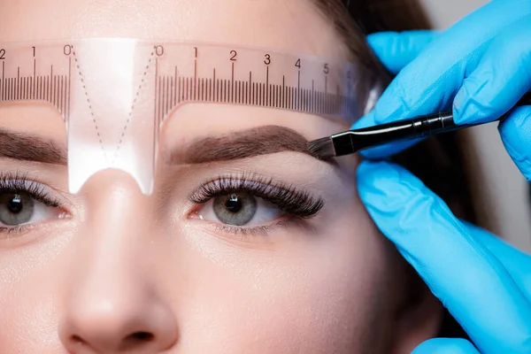 Eyebrow concept. Beautiful thick eyebrows, a vivid glance. Perfect eyebrows, make-up correction