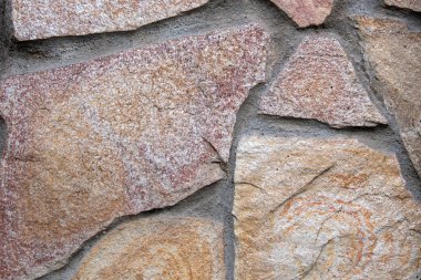 Doğal taştan arka plan. Grunge ve paslı kaya dokusu.