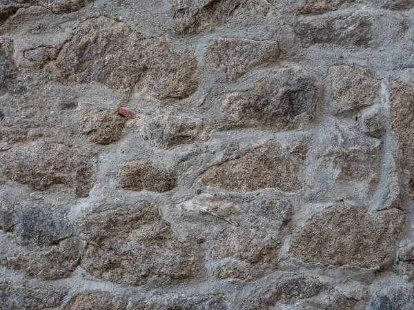 Textured Stone Walls Built Large Stones Held Together Dark Lumps — стоковое фото