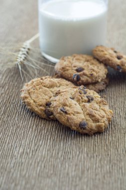 Homemade cookies  and milk on textile surface 