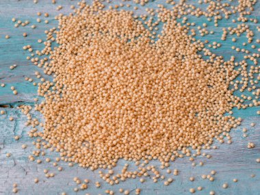 Amaranth grain seeds close up pattern background high angle view selective focus