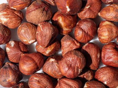 Hazelnut close-up Background. Heap of peeled hazelnuts.