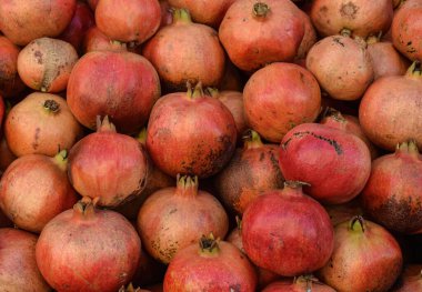 Group of pomegranates. Pomegranate closeup, selective focus