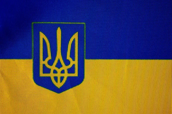 The flag of Ukraine on which the coat of arms is depicted. — Zdjęcie stockowe
