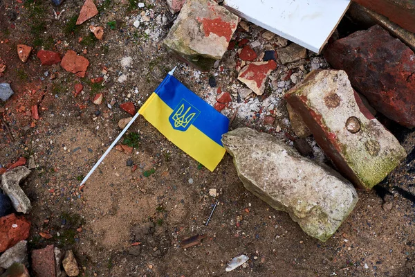 The flag of Ukraine lies on the ground. — Stok fotoğraf