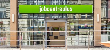 Newcastle upon Tyne, United Kingdom, 11 July 2022 - Exterior view of the Jobcentre Plus in the centre of Newcastle. People visit the employment center. Offices of Jobcentre Plus exterior.